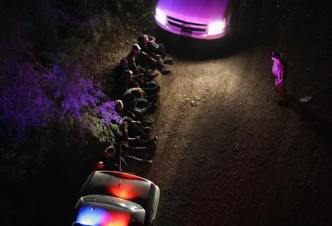 U.S. border agents take undocumented immigrants into custody after capturing them after they crossed Rio Grande from Mexico into Texas on Aug. 18, 2016. (John Moore/Getty Images)