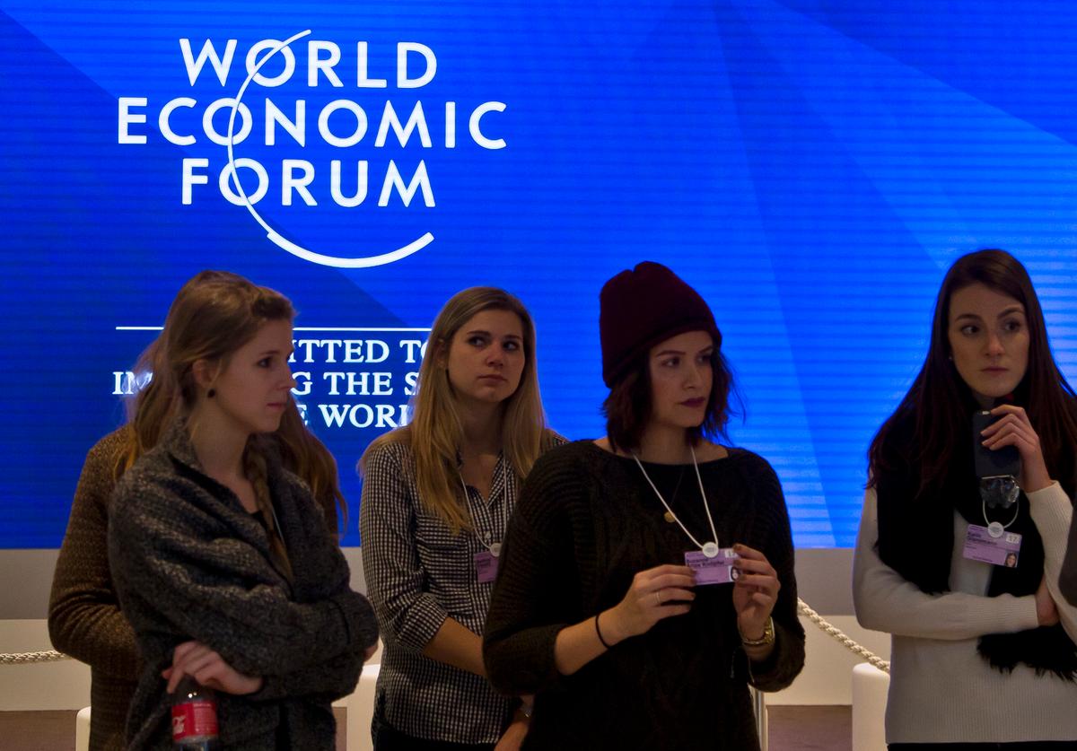 Staff members are briefed at the congress center where the annual meeting, World Economic Forum, will take place in Davos, Switzerland on Jan. 15, 2017. (AP Photo/Michel Euler)