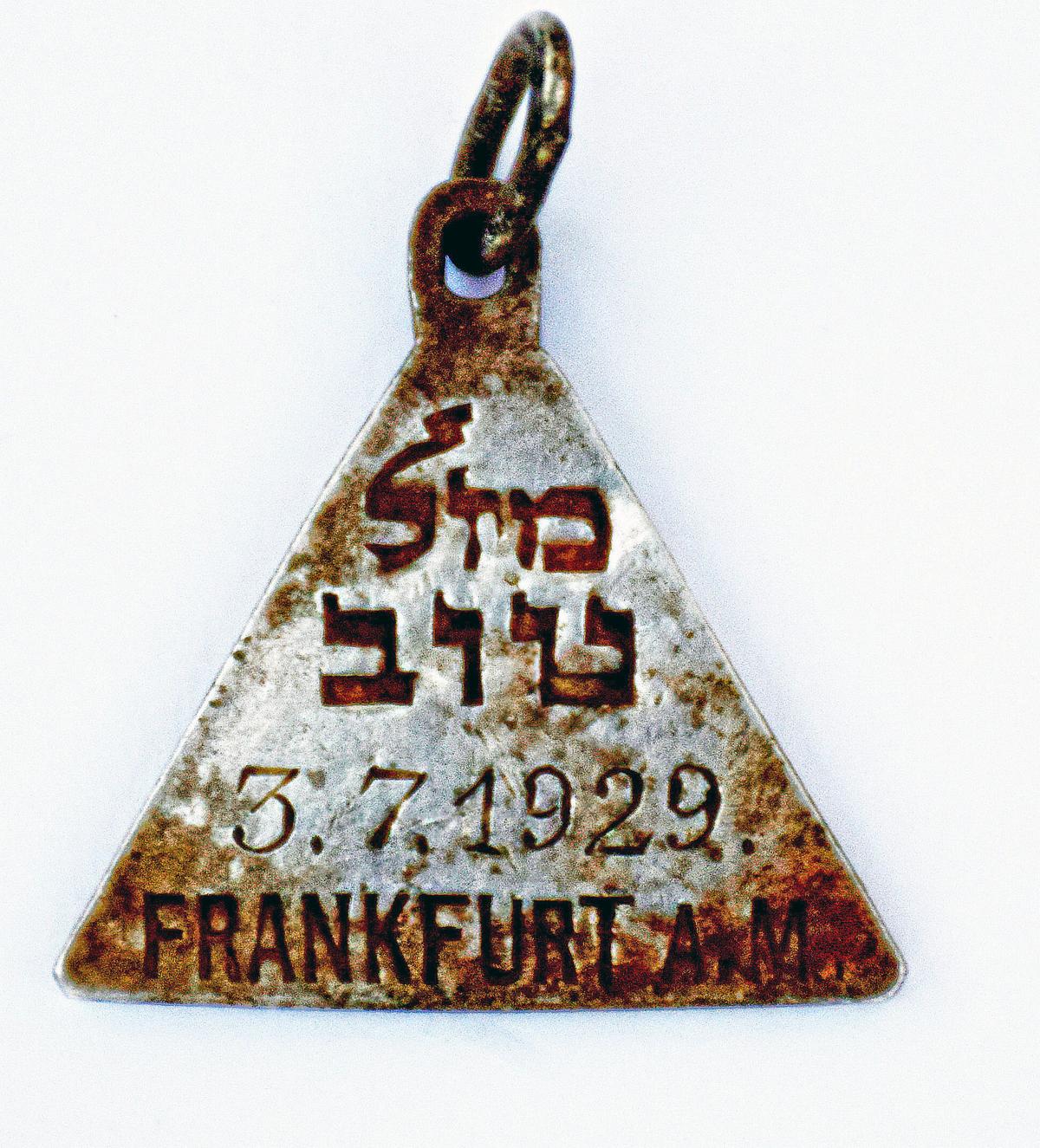 A pendant that appears identical to one belonging to Anne Frank. (Yoram Haimi, Israel Antiquities Authority via AP)