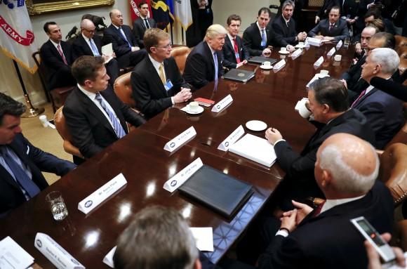 President Donald Trump hosts breakfast with business leaders in the Roosevelt Room of the White House in Washington on Jan. 23, 2017. (AP Photo/Pablo Martinez Monsivais)