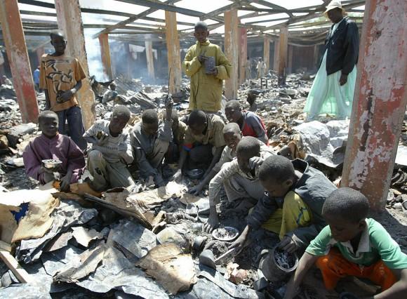 Children search for melted aluminium among ashes of a burnt central market during fighting between the Chadian army and insurgents on Feb. 9, 2008, in N'Djamena, Chad. Scrap aluminum is often used in Africa to make cooking pots, which release lead and other toxins into food, according to a study published in the February 2017 issue of the journal Science of the Total Environment. (Kambou Sia/AFP/Getty Images)