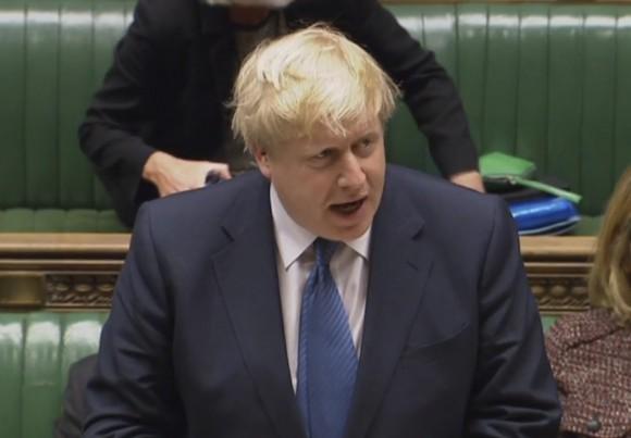 Foreign Secretary Boris Johnson makes a statement regarding US President Donald Trump's travel ban in the House of Commons, London on Jan. 30, 2017. (PA via AP)