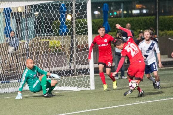 A let off for HKFC after keeper Issey Maholo saves as KC Southern's Roberto Fronza can't quite get the return under control. (Bill Cox/Epoch Times)