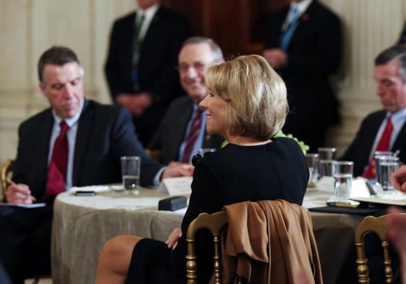 Secretary of Education Betsy DeVos listens to U.S. President Donald Trump at the National Governors Association meeting in the State Dining Room of the White House in Washington on Feb. 27, 2017. (Aude Guerrucci-Pool/Getty Images)