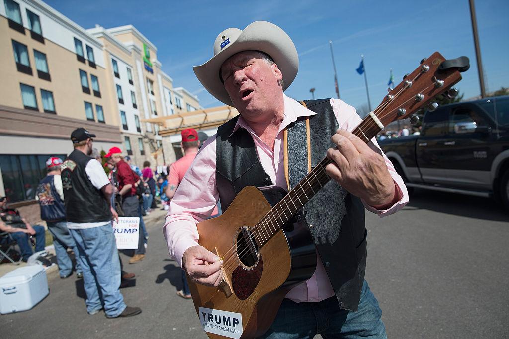 Kraig Moss sings his support for Republican presidential candidate Donald Trump at a rally at the Holiday Inn Express hotel in Janesville, Wisconsin on March 29, 2016. (Scott Olson/Getty Images))