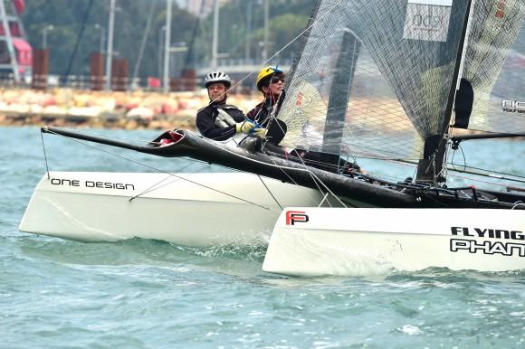Mark Thornburrow (L) helming Flying Phantom "Flyer", winner of the RHKYC Tomes Cup in Victoria Harbour on Saturday April 29, 2017. This photo shows "Flyer" prior to the start of the Nations Cup on Sunday April 30, 2017. (Bill Cox/Epoch Times)