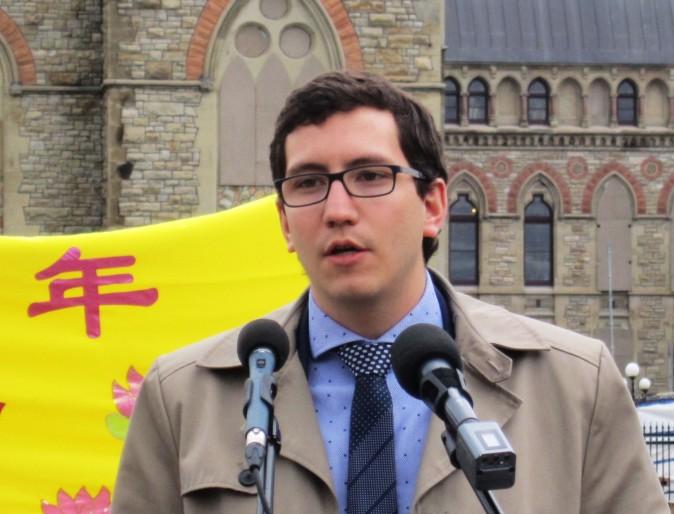 NDP MP Pierre-Luc Dusseault speaks at a celebration on Parliament Hill marking the 25th anniversary of Falun Gong, May 9, 2017. (Evan Ning/Epoch Times)