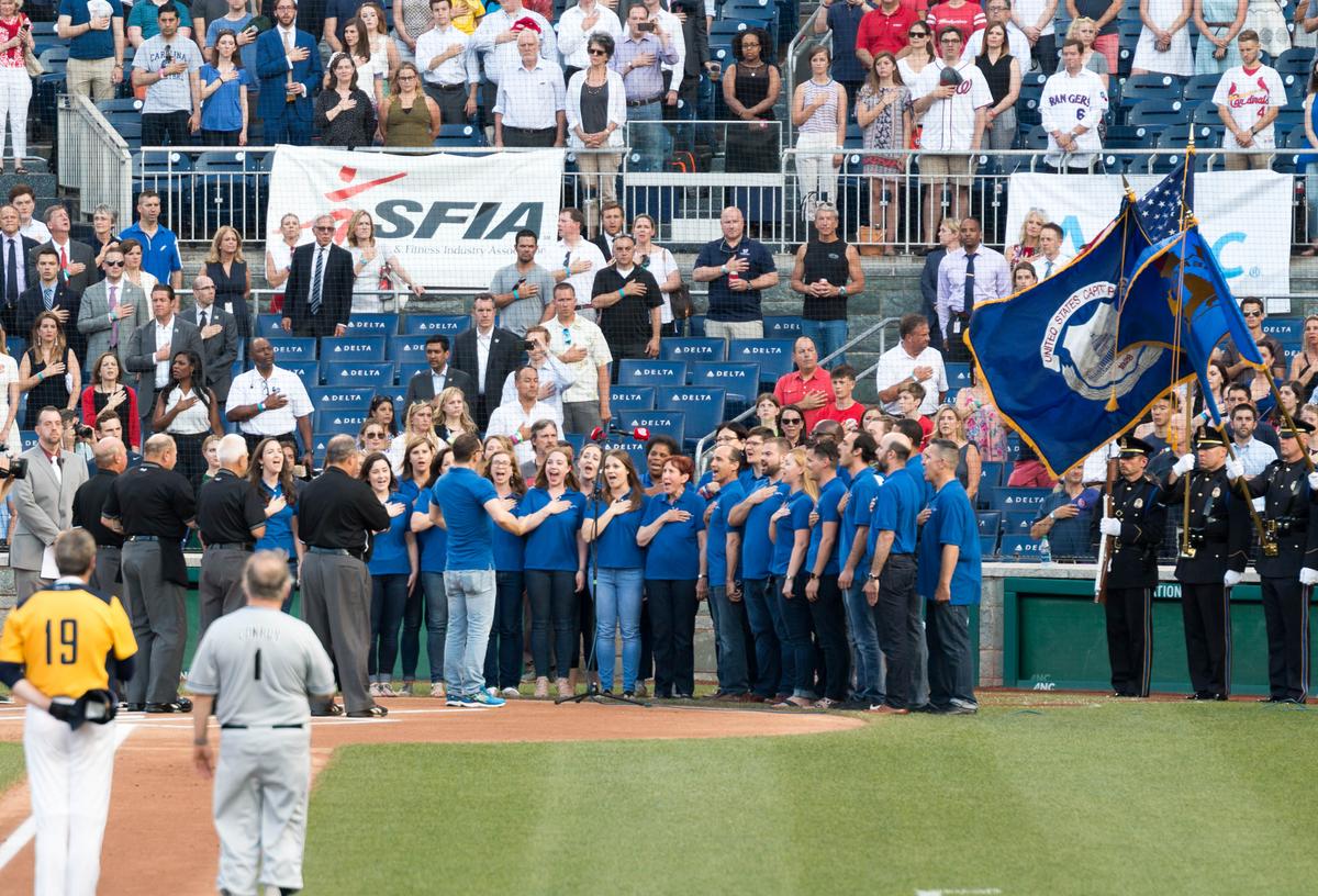 Singing of the national anthem before the start of the Congressional Baseball Game on Thursday. (Paul Huang)
