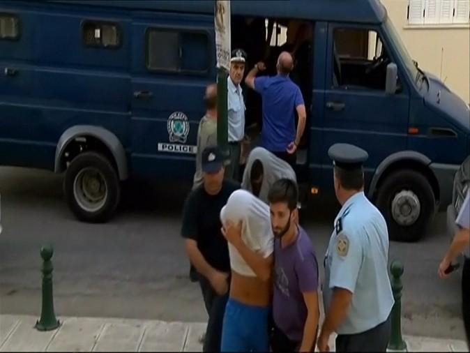 Suspects arrive at a Zakynthos courthouse on July 8 for their arraignment—their involvement in the death of an American tourist on the Greek island. (Reuters)