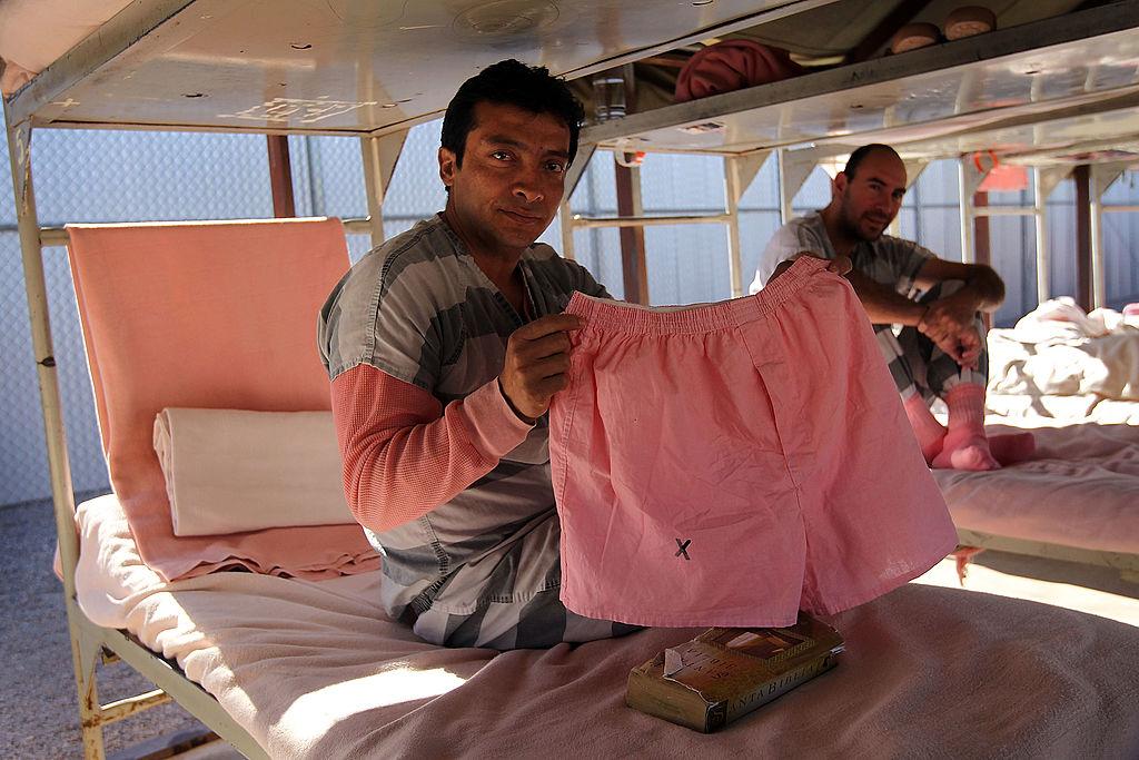 Undocumented immigrant Sam Ramos, 39, shows off his jail-issued pink underwear in the Maricopa County "Tent City Jail" on April 30, 2010 in Phoenix, Arizona. (John Moore/Getty Images)