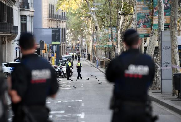 Police officers patrol on Las Ramblas following yesterday's terrorist attack, on August 18, 2017 in Barcelona, Spain. (Photo by Carl Court/Getty Images)