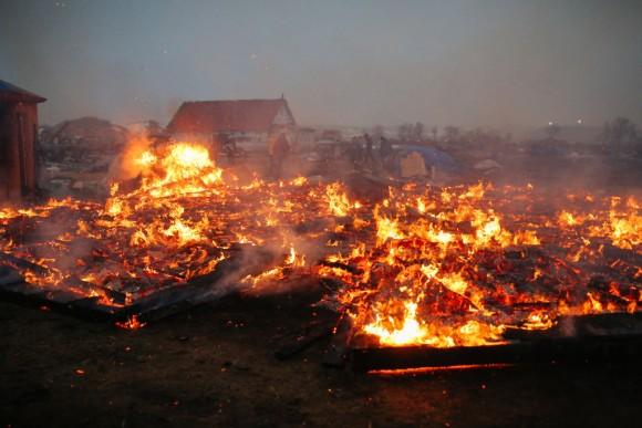 Activists and protesters set structures on fire in preparation of the Army Corp's 2pm deadline to leave the Oceti Sakowin protest camp on February 22, 2017 in Cannon Ball, North Dakota. (Stephen Yang/Getty Images)