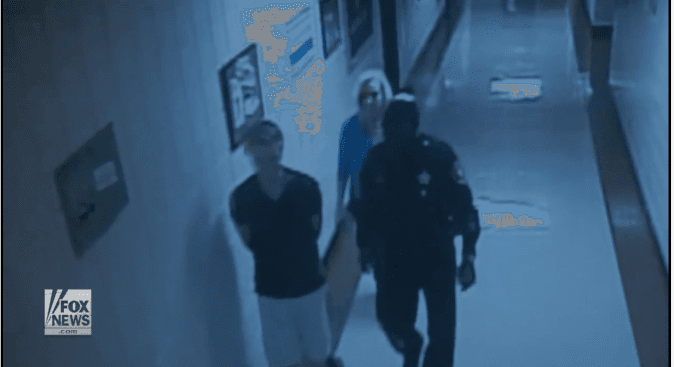 The autistic boy and school resource deputy Ural Darling. (Screenshot Via Fox)