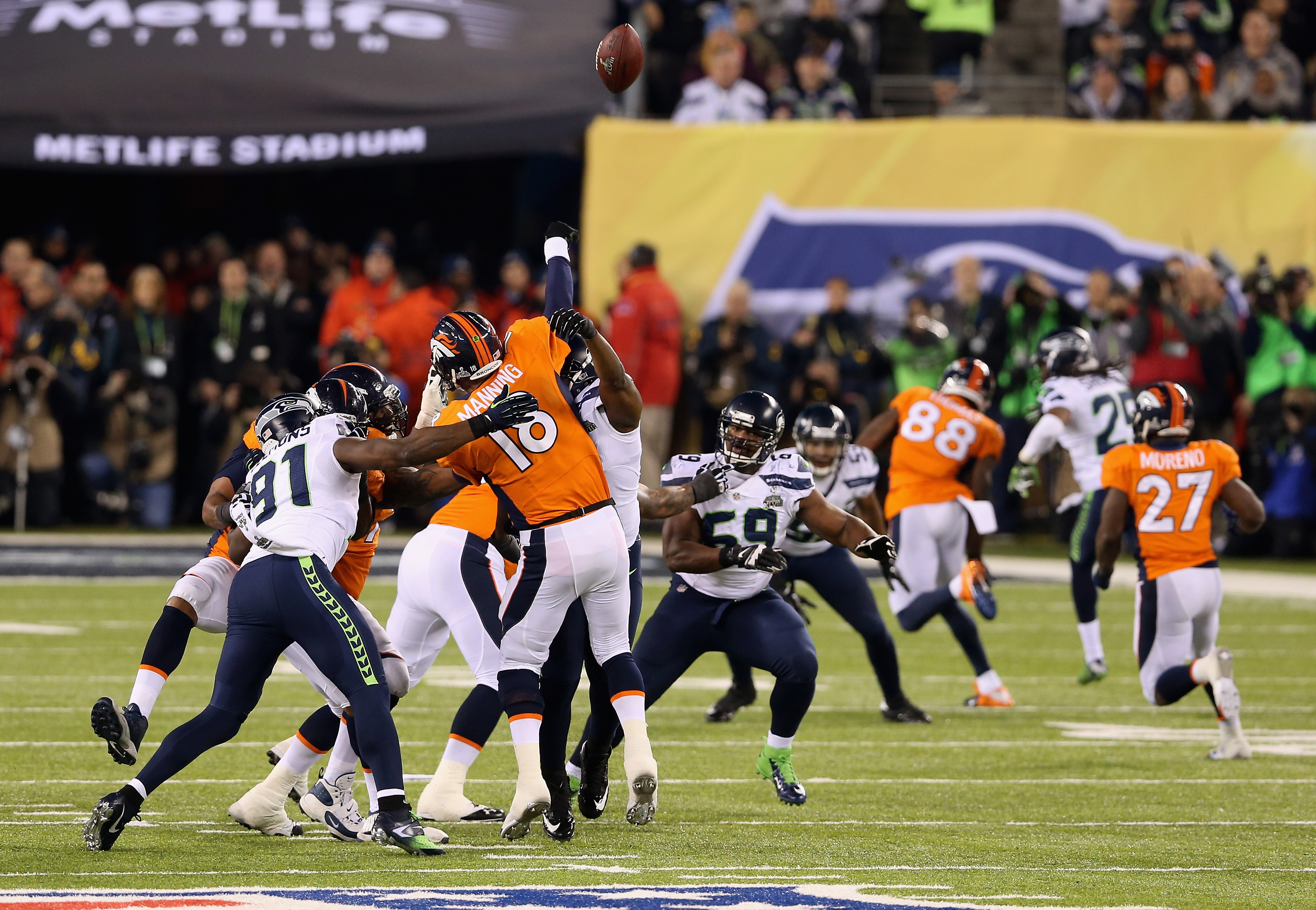 Denver Broncos quarterback Peyton Manning (18) throws a pass against the  Seattle Seahawks during the Super Bowl XLVIII at MetLife Stadium in East  Rutherford, New Jersey on February 2, 2014. The Seattle