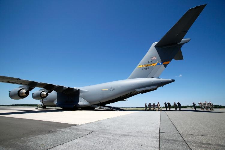 Members of a U.S. Marine Corps head to a C-17 cargo plane in St. Louis. (Alex Wong/Getty Images)