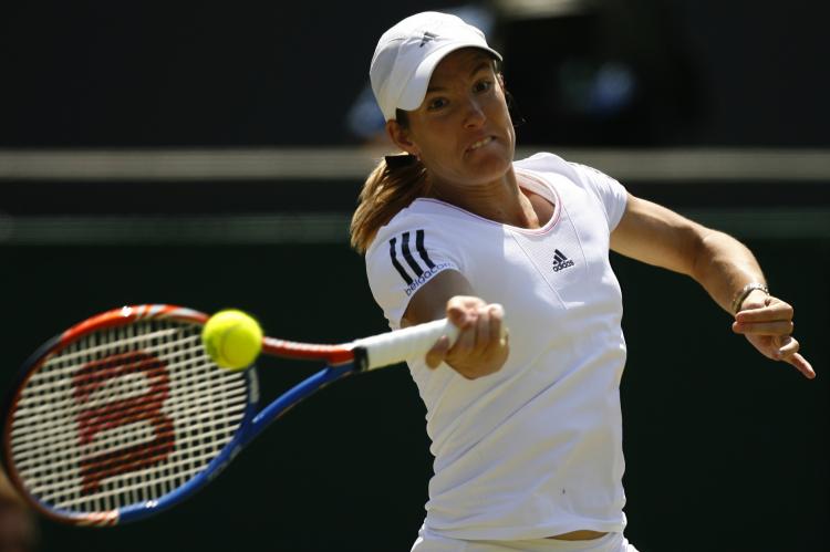 Justine Henin returns a ball to Kim Clijsters during the Wimbledon Tennis Championships on June 28. (Glyn Kirk/AFP/Getty Images)