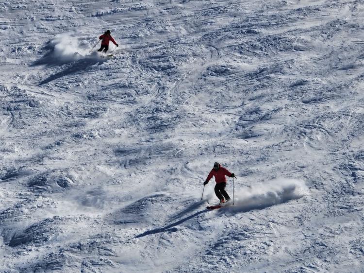 Skiers descend a mountain at Valle Nevado skiing centre in the Andes Mountains, some 50 km from Santiago, on August 13, 2010. (Martin Bernetti/AFP/Getty Images)