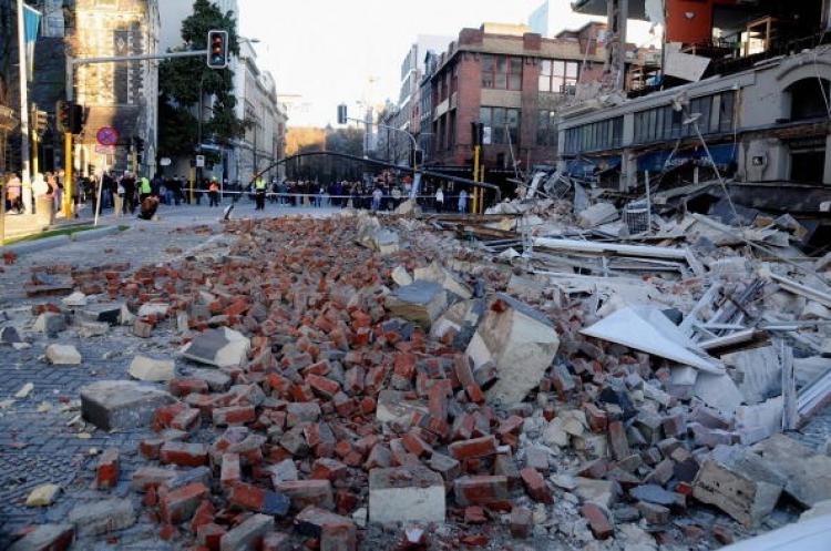 Building rubble is strewn across the street from damaged buildings in the city centre after a 7.1 magnitude earthquake struck 30km west of Christchurch city at 4:35 am on the morning of September 4.  (Photo by Kurt Langer/Getty Images)