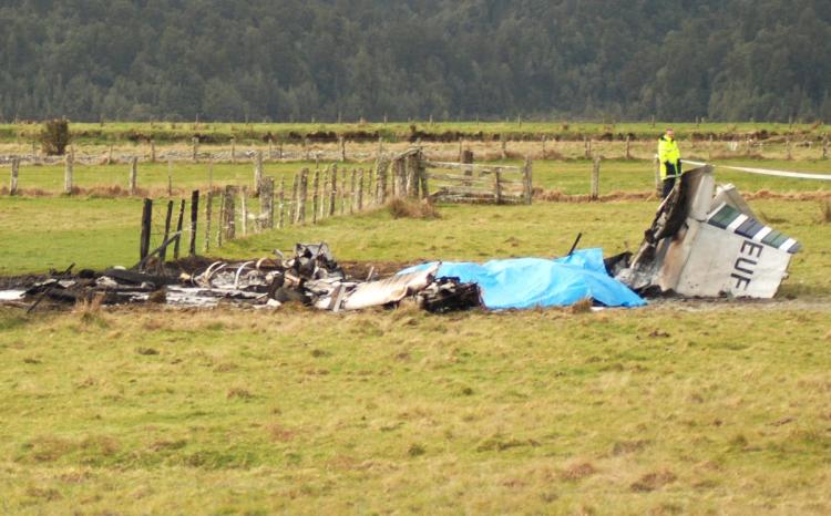 The wreckage of the crashed skydiving plane is seen at the end of the runway at Fox Glacier Airport on September 4, 2010 in Fox Glacier, New Zealand. The plane crashed on take off on Saturday afternoon, resulting in the deaths of all 9 tourists and crew o (Janna Sherman/Hokitika Guardian/Getty Images)