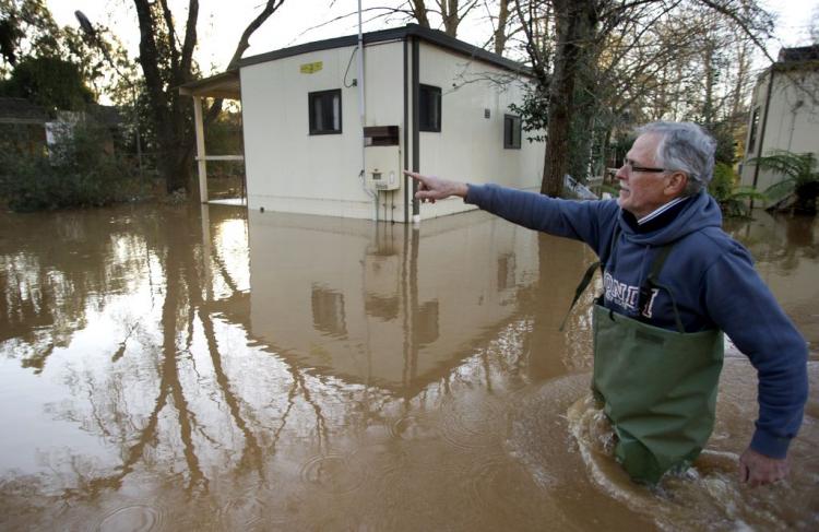 Local Geoffrey Scott inspects his flooded caravan park as floods hit the northern Victorian town of Myrtleford, some 250 kms northeast of Melbourne, on September 6, 2010.  (William West/AFP/Getty Images)