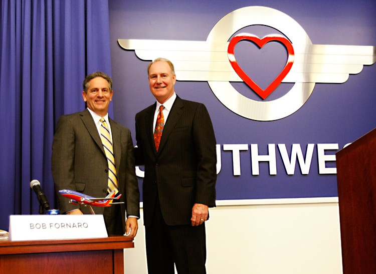 AIRLINE MERGERS: AirTran CEO Robert L. Fornaro (L) and Southwest Airlines CEO Gary Kelly pose following a press conference about Southwest Airlines' plan to merger with AirTran Airways at Southwest Airlines Corporate Headquarters Sept. 27, 2010, in Dallas, Texas. Southwest Airlines Co. closed on the acquisition of AirTran Holdings Inc. in May, the former parent of AirTran Airways Inc., at a cost of about $3.2 billion. (Photo by Lawrence Jenkins/Getty Images)