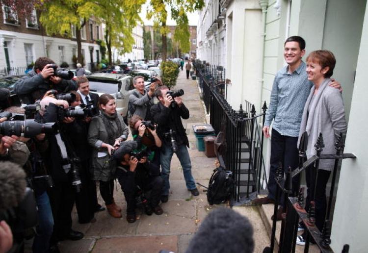 David Miliband, brother of Labour leader, Ed, poses with his wife Louise for photographers on the steps of their London home on September 29, 2010. (Peter Macdiarmid/Getty Images)