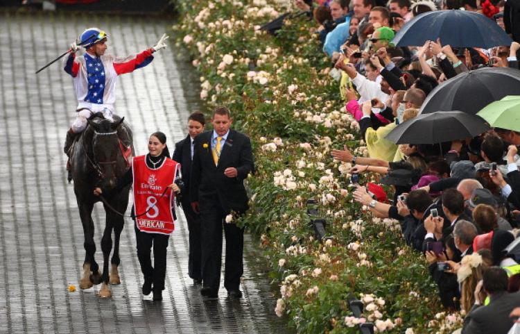 Gerald Mosse riding Americain celebrates after winning race seven, the Emirates Melbourne Cup, during Melbourne Cup Day at Flemington Racecourse on Nov. 2, in Melbourne. (Robert Cianflone/Getty Images)