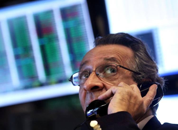 STOCKS RISING: Traders work on the floor of the New York Stock Exchange before the closing bell earlier this month in New York City. After last Friday's trading session, the S&P 500 Index reached its highest level since late 2008.