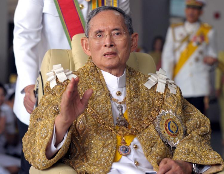 Thai King Bhumibol Adulyadej waves to well-wishers after the royal ceremony for his 83rd birthday in Bangkok on December 5, 2010. (Pornchai Kittiwongsakul/AFP/Getty Images)