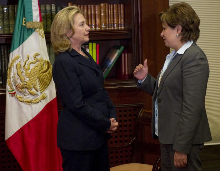 Mexican Foreign Minister Patricia Espinosa (R) talks with Hilary Clinton about border security and drug trafficking during a visit to Mexico City. (Saul Loeb/AFP/Getty Images)