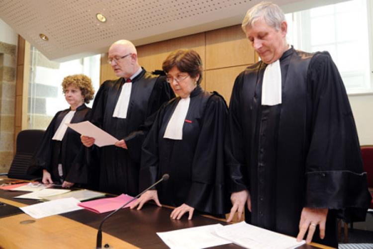 Rennes appeal court magistrates reading a motion announcing the adjournment of non-emergency hearings at the headquarters of Rennes appeal court on February 8, in Rennes, western France.  (Damien Meyer/Getty Images )