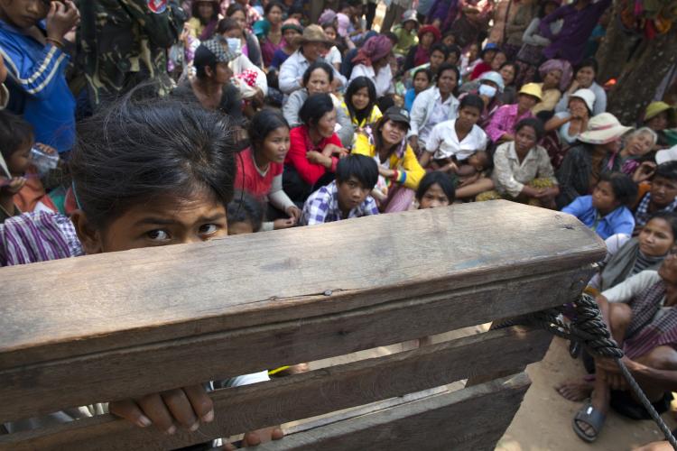 Displaced Cambodians fleeing the fighting at Preah Vihear temple as they wait for aid from the Cambodian Red Cross at a makeshift refugee camp February 9, 2011 in the rural village of Thnal Bek, Cambodia.  (Paula Bronstein/Getty Images)