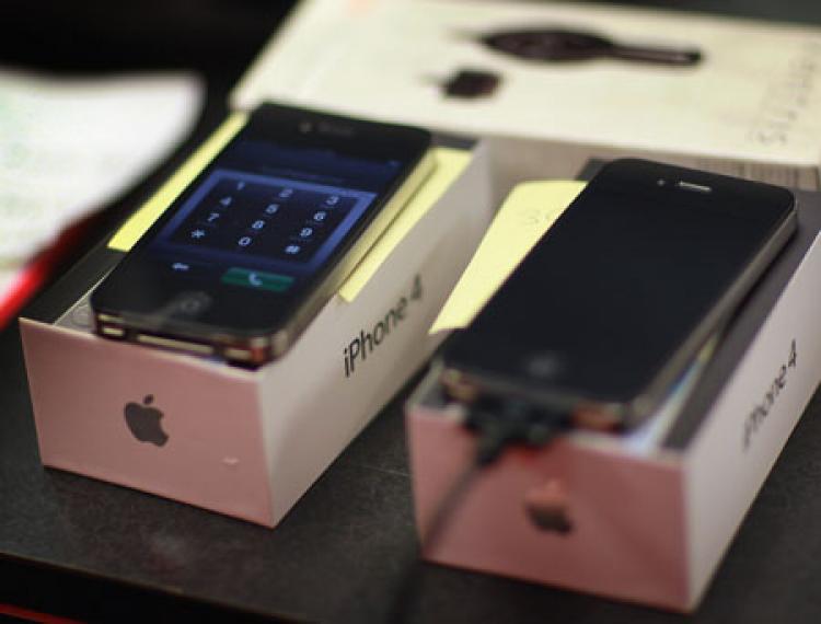 iPhones are seen as they are charged for customers after being sold at a Verizon Wireless store after they started selling the smart phone on February 10, 2011 in Coral Gables, Florida. AT&T had previously had a monopoly on selling the iPhone since 2007.  (Joe Raedle/Getty Images)