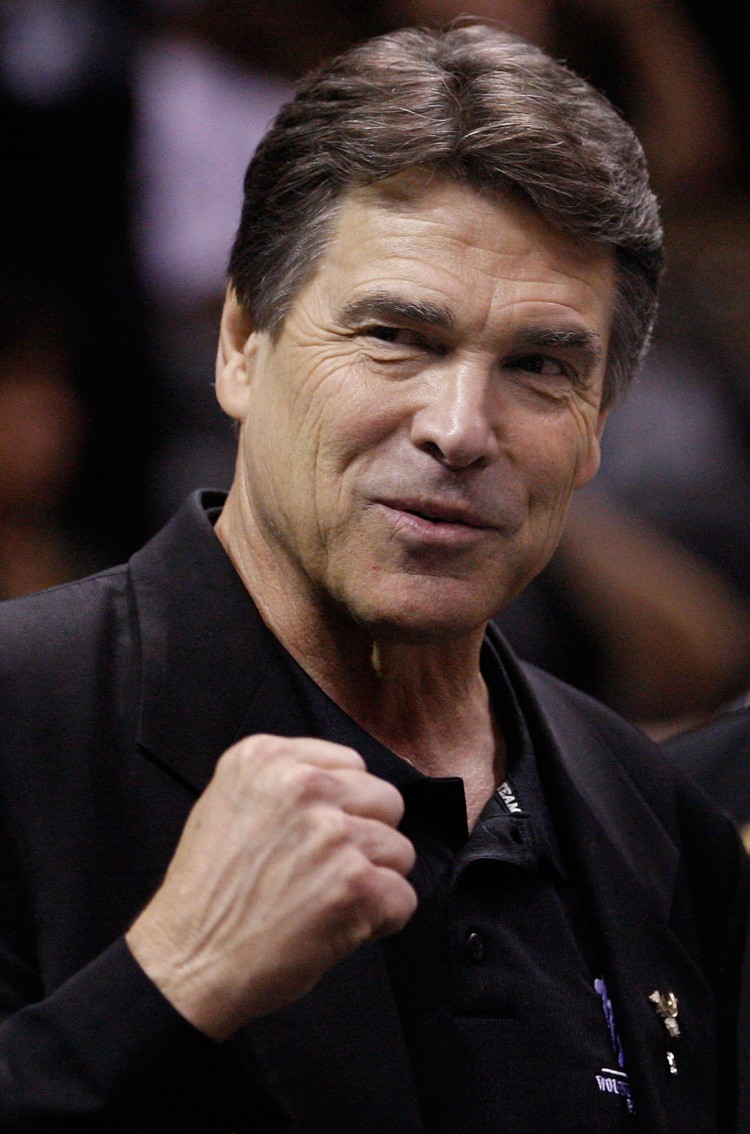 Texas Gov. Rick Perry attends a game at AT&T Center on March 4 in San Antonio, Texas. After months of indecision, Perry said on May 27 that he will consider seeking the Republican presidential nomination. (Ronald Martinez/Getty Images)