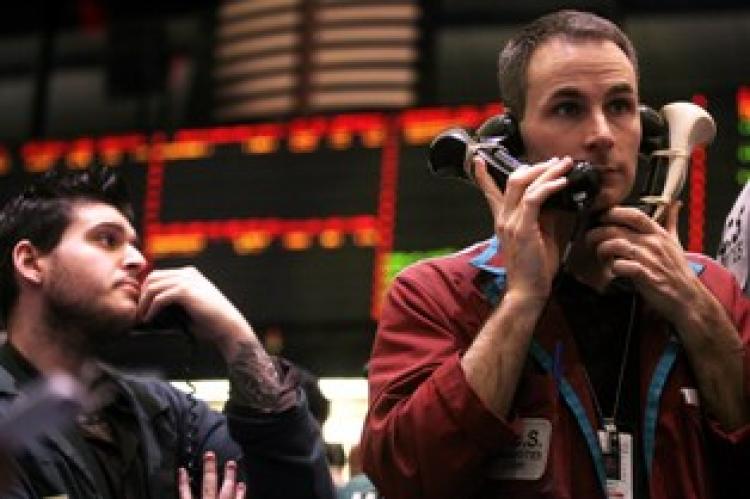 Traders work in the crude oil options pit at the New York Mercantile Exchange on March 22 in New York City. (Photo by Mario Tama/Getty Images)