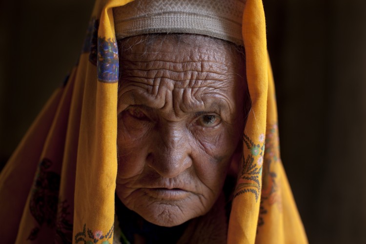 Hava Gul, 70, waits to see a doctor complaining about her left eye at a local mosque made into a makeshift mobile health clinic June 12, 2011, in the village of Gharmboloq. (Paula Bronstein/Getty Images)