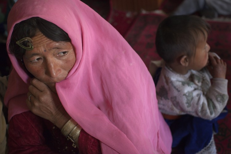 Villagers wait for medical treatment in a makeshift mobile health clinic June 12, 2011, in the village of Gharmboloq, in Shahidan district, Afghanistan. (Paula Bronstein/Getty Images)