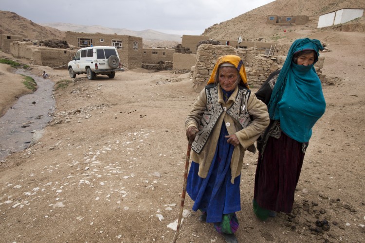 Villagers leave a local mosque made into a makeshift mobile health clinic after getting medical treatment June 12, 2011. (Paula Bronstein/Getty Images)