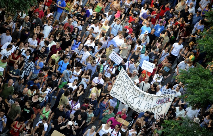 Protesters demonstrate in Valencia on June 19. Similar demonstrators were also held in Madrid and Barcelona. (Jose Jordan/AFP/Getty Images)