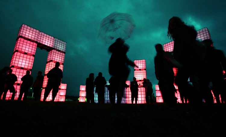 Festival-goers gather at Cubehenge in the Dance Village area at the at the Glastonbury Festival site. (Matt Cardy/Getty Images)