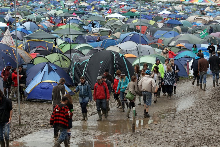 Festival-goers move around the fields of tents at the Glastonbury Festival site. (Matt Cardy/Getty Images)