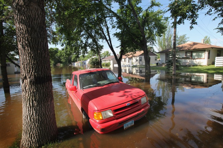 Water from the rising Souris River floods a neighborhood on June 25, 2011 in Minot, North Dakota. (Scott Olson/Getty Images)