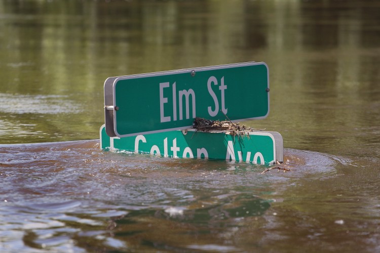 Floodwater nearly covers a street sign June 26, 2011 in Burlington, North Dakota. (Scott Olson/Getty Images)