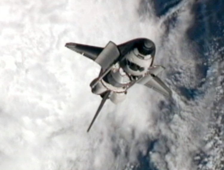 NASA space shuttle Atlantis goes through a nine-minute Rendezvous Pitch Maneuver, or back flip to enable space station crew members to take high resolution digital pictures of the shuttle's heat shield July 10, 2011 in space. (NASA via Getty Images)