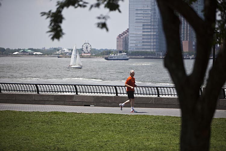 A man runs along the Hudson River in Battery Park City in Lower Manhattan, on July 12, 2011 in New York City. (Ramin Talaie/Getty Images)