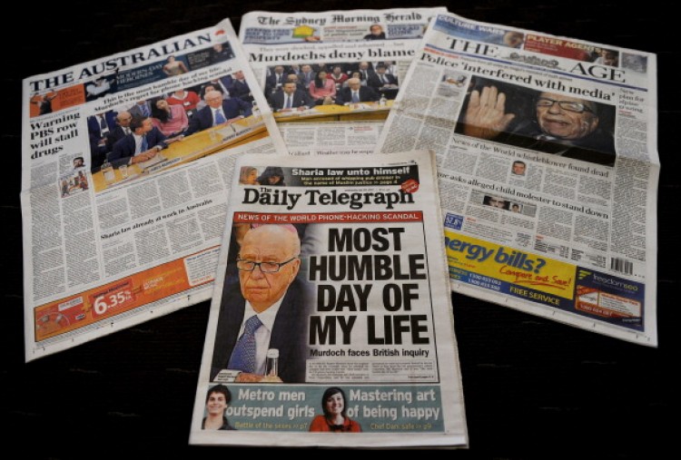 Australian newspaper front pages displayed in Sydney, on July 20, detail the results of the appearance of Rupert Murdoch and his son James Murdoch at a parliamentary committee hearing, in London. (Greg Wood/AFP/Getty Images)