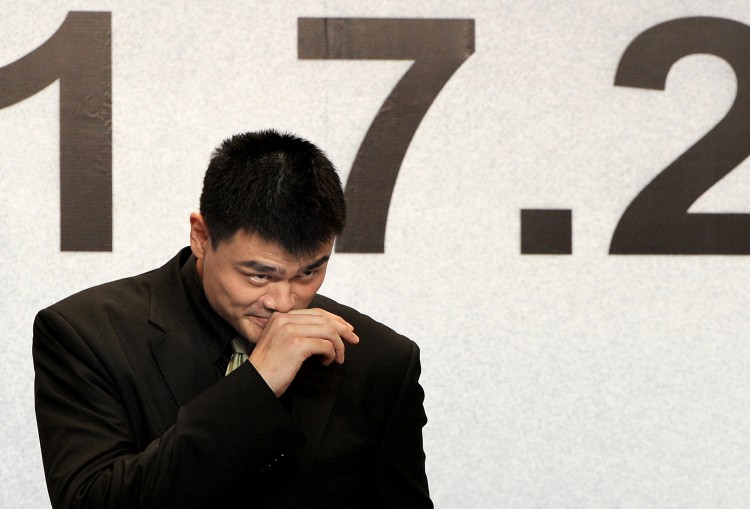 China's most famous basketball player Yao Ming, gestures during a press conference in which he announced his retirement in Shanghai on July 20.    (Philipee Lopez/Getty Images)