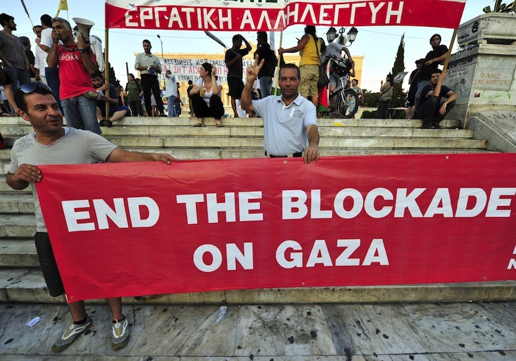 Greek and foreign pro-Palestinian activists demonstrate in front of the Greek parliament against the Israeli interception in the international waters of a French yacht as it tried to reach Gaza in defiance of Israel's naval blockade on Palestinian Palestinian territory on July 19. (Louisa Gouliamaki/AFP/Getty Images)