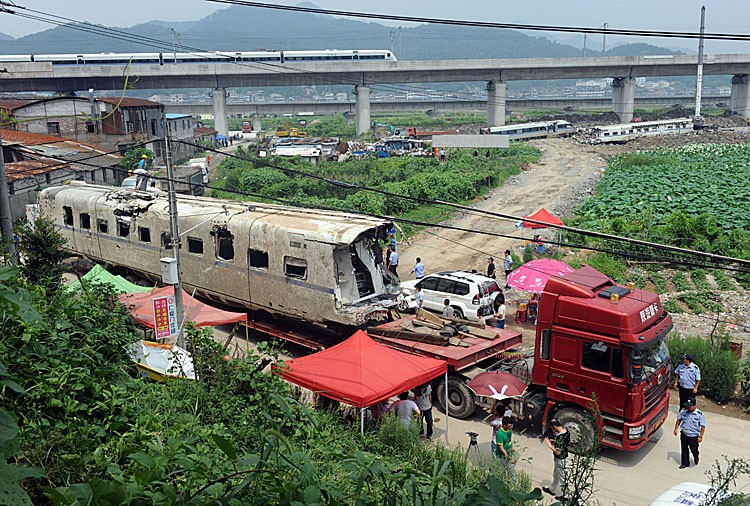 The wreckage of high-speed train carriage is carried on a truck, two days after a fatal collision, in Shuangyu, on the outskirts of Wenzhou in the eastern Chinese province of Zhejiang, on July 26, 2011. The death toll from the July 23 crash has risen to 39, with nearly 200 others wounded. (STR/AFP/Getty Images)