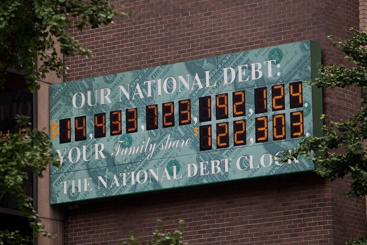 The National Debt Clock, a billboard-size digital display showing the increasing US debt